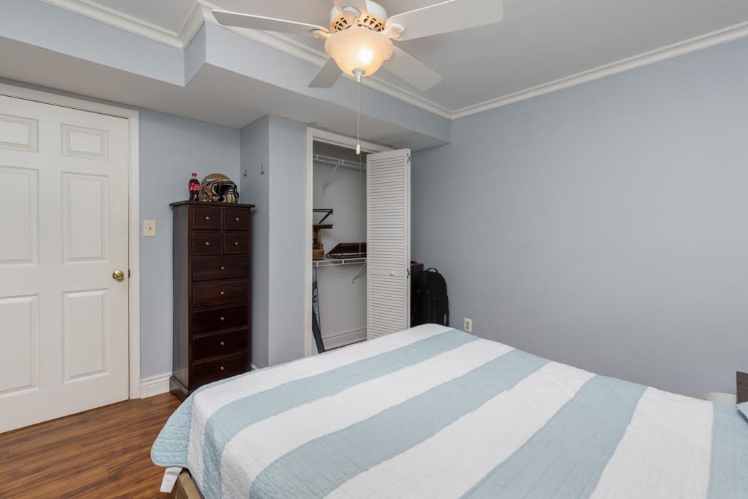 1207 Middlebrook Road Staunton, VA 24401 - Photo 34 of 62 a bedroom with a bed and a chandelier