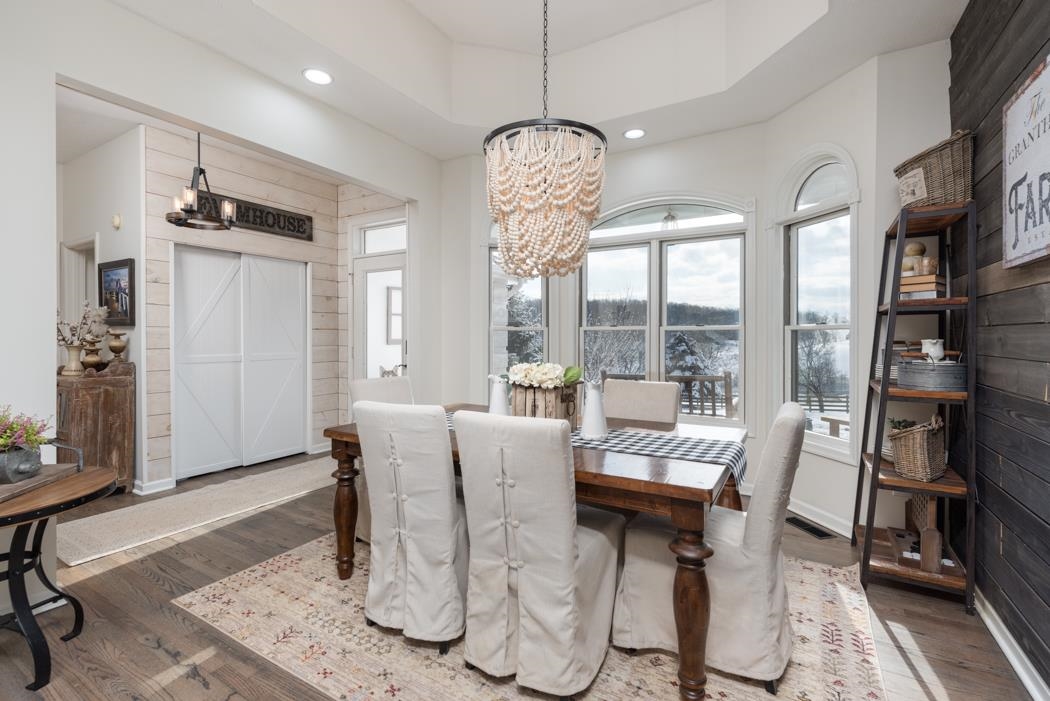 1207 Middlebrook Road Staunton, VA 24401 - Photo 5 of 62 a dining room with furniture a chandelier and wooden floor