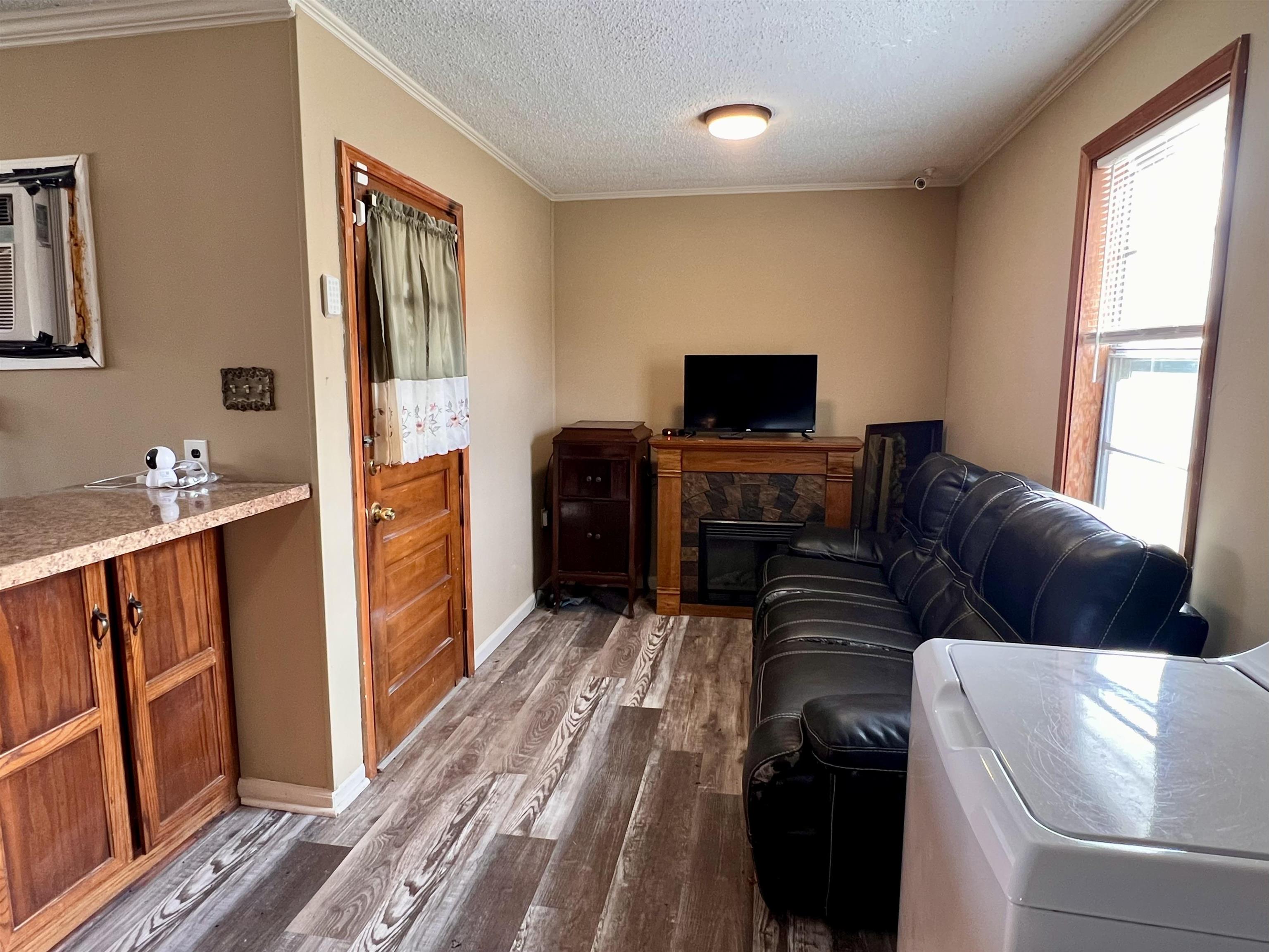 597 Walton Loop Covington, TN 38019 - Photo 4 of 16 a living room with furniture and a flat screen tv