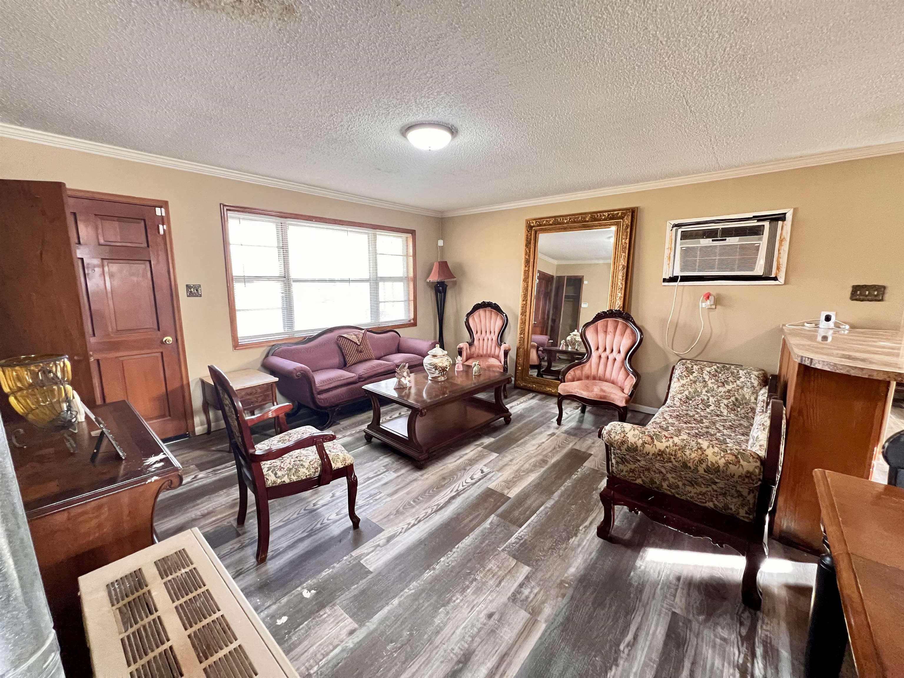 597 Walton Loop Covington, TN 38019 - Photo 6 of 16 a living room with furniture and wooden floor