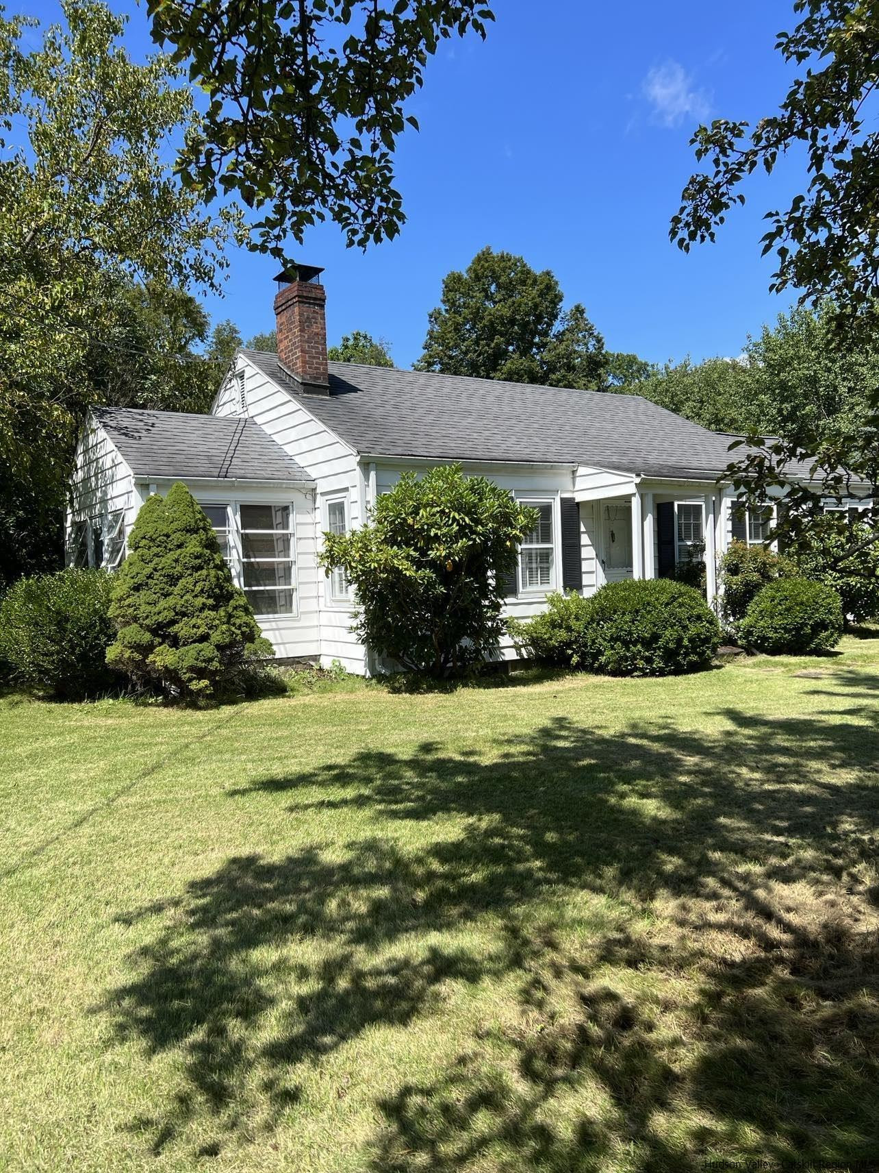 3615 Atwood Road Stone Ridge, NY 12484 - Photo 1 of 22 a front view of a house with a garden