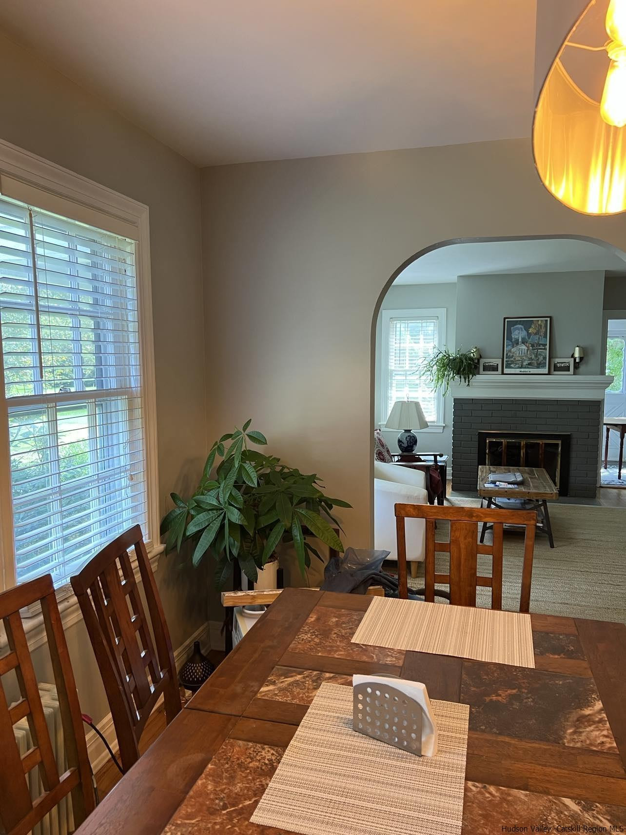 3615 Atwood Road Stone Ridge, NY 12484 - Photo 12 of 22 a living room with furniture a window and a fireplace
