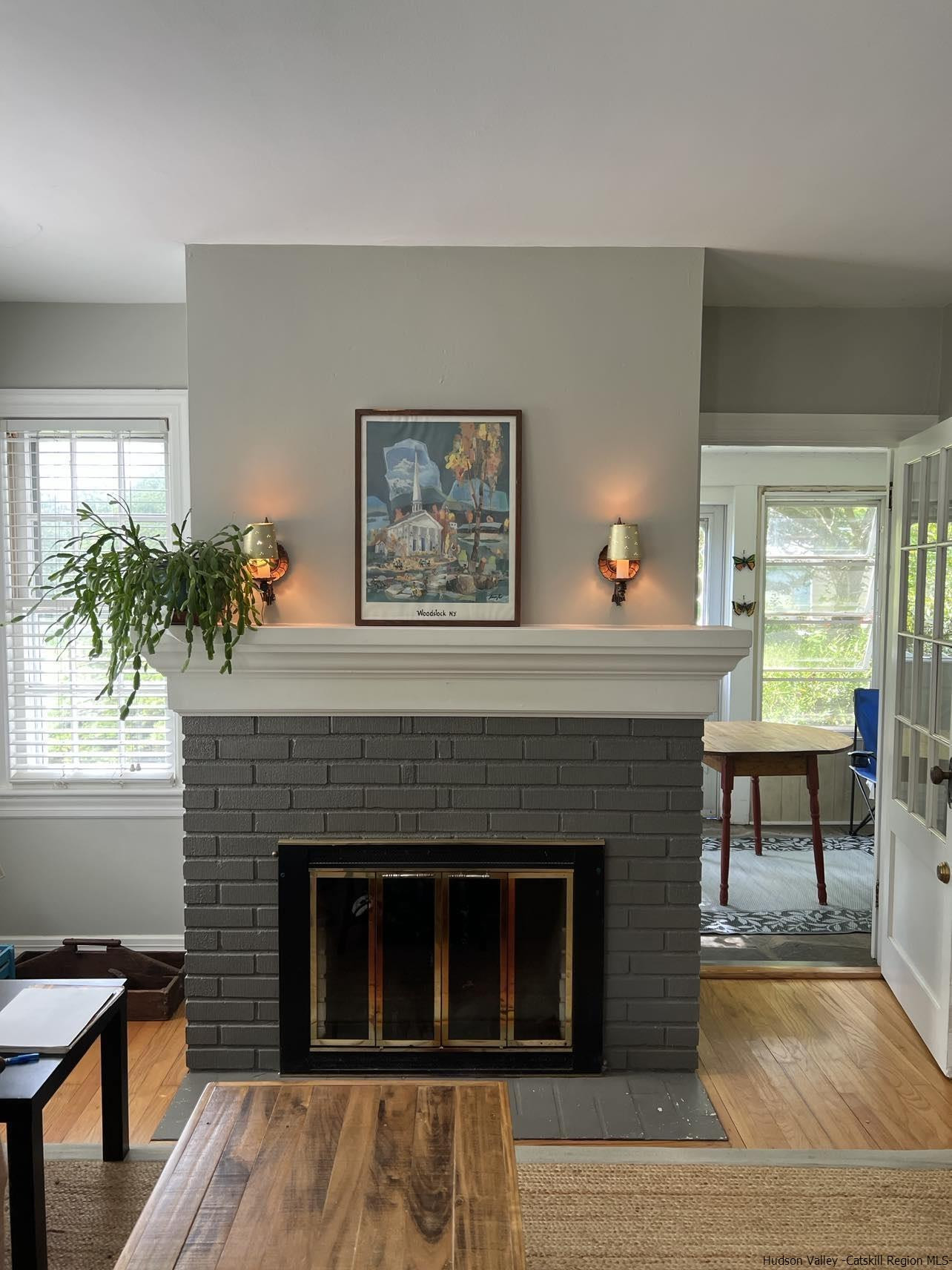 3615 Atwood Road Stone Ridge, NY 12484 - Photo 14 of 22 a living room with a fireplace and a large window