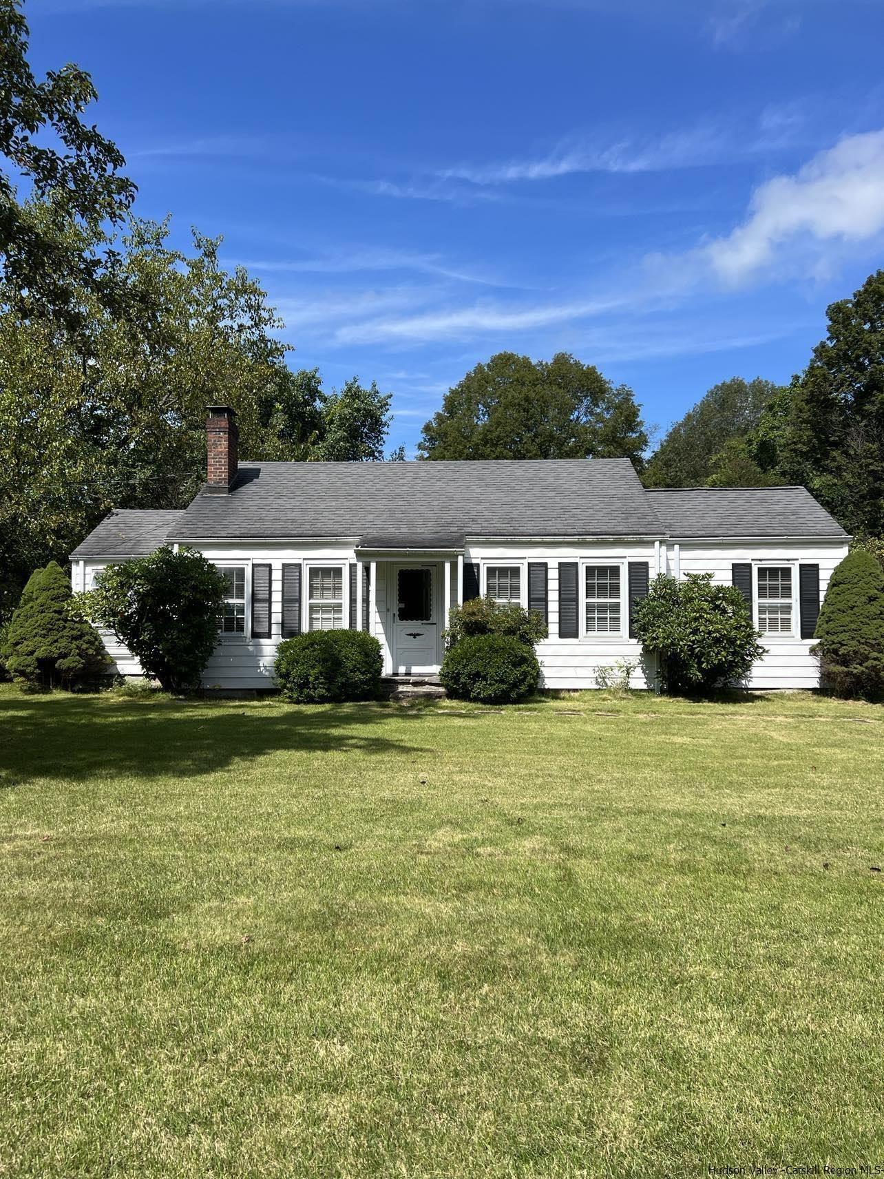 3615 Atwood Road Stone Ridge, NY 12484 - Photo 2 of 22 a front view of a house with a garden