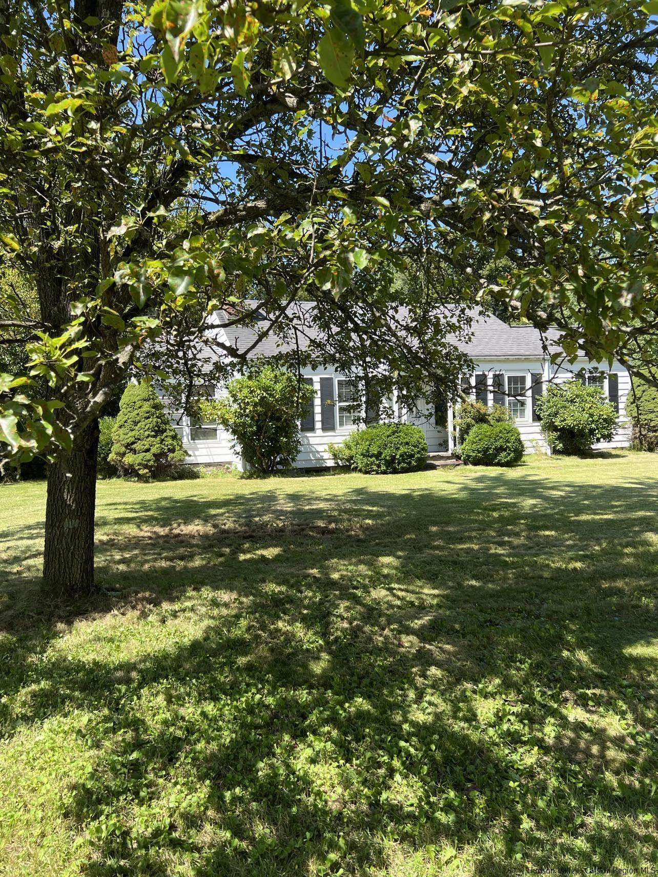 3615 Atwood Road Stone Ridge, NY 12484 - Photo 3 of 22 a front view of a house with a yard