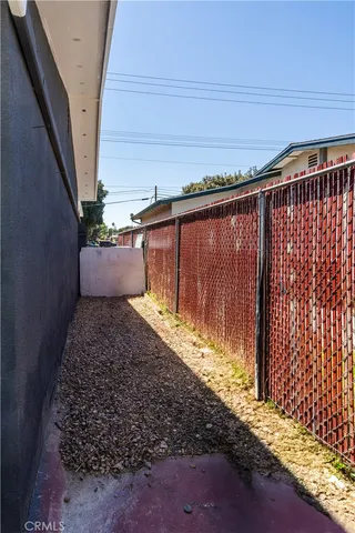 a view of balcony with wooden floor and outdoor seating