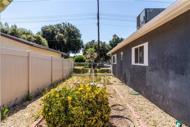 a view of a chair and tables in the patio