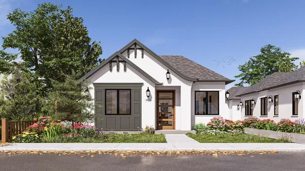 a front view of a house with a garden