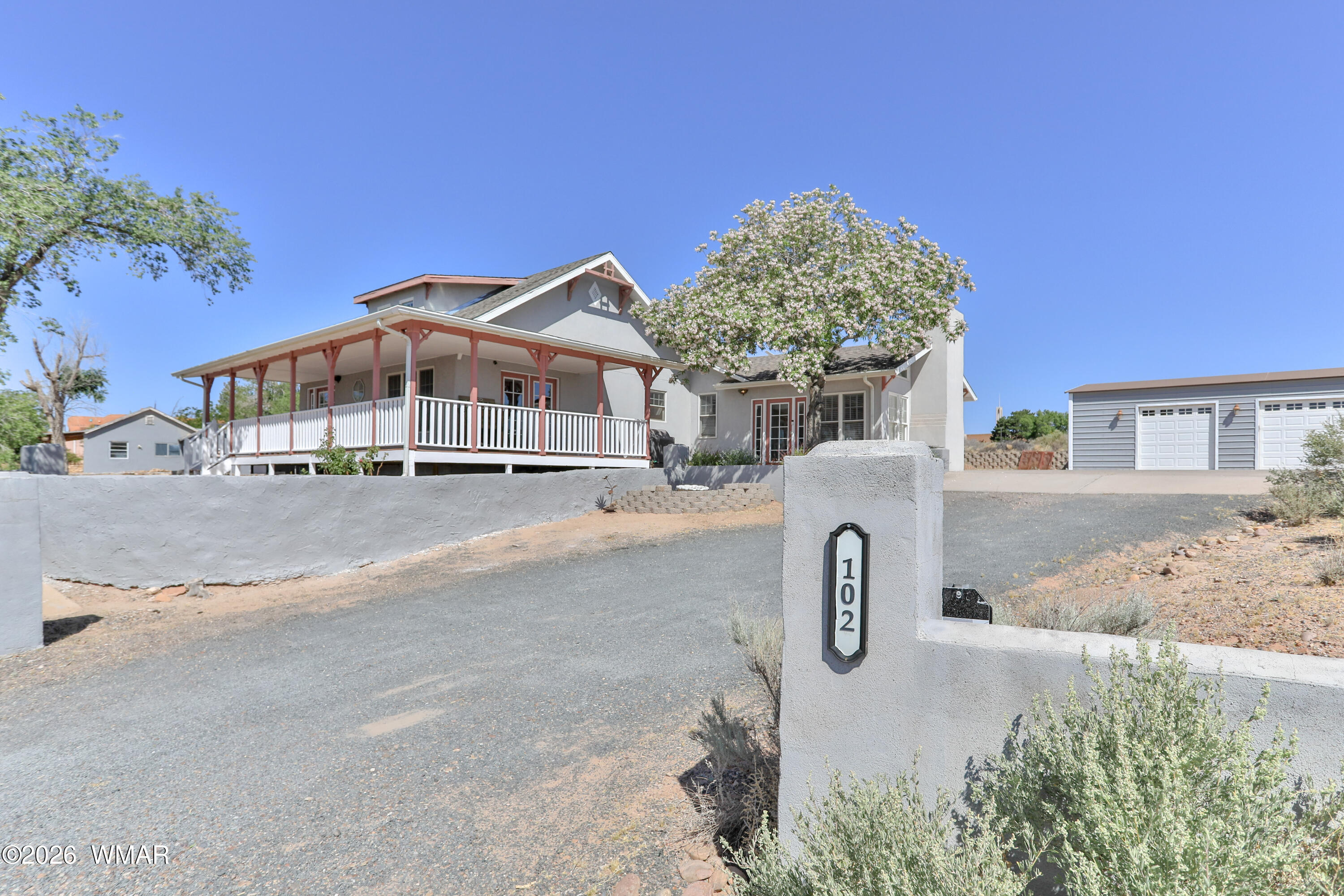 102 Crestview Road Holbrook, AZ 86025 - Photo 55 of 55 a view of a house with a yard and large trees