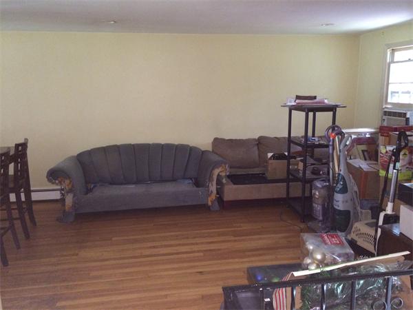 45 Gilson Road Groton, MA 01450 - Photo 3 of 9 a living room with furniture and a wooden floor
