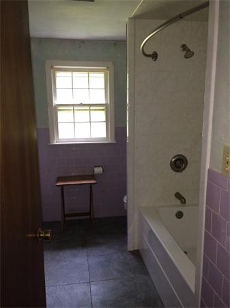 45 Gilson Road Groton, MA 01450 - Photo 5 of 9 a bathroom with a bathtub and a shower