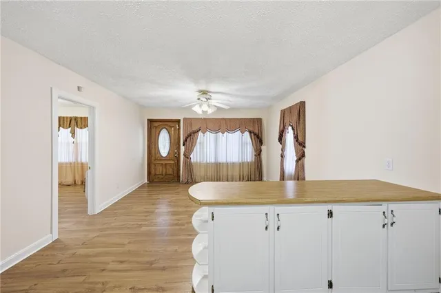 a kitchen with kitchen island a counter top space and cabinets
