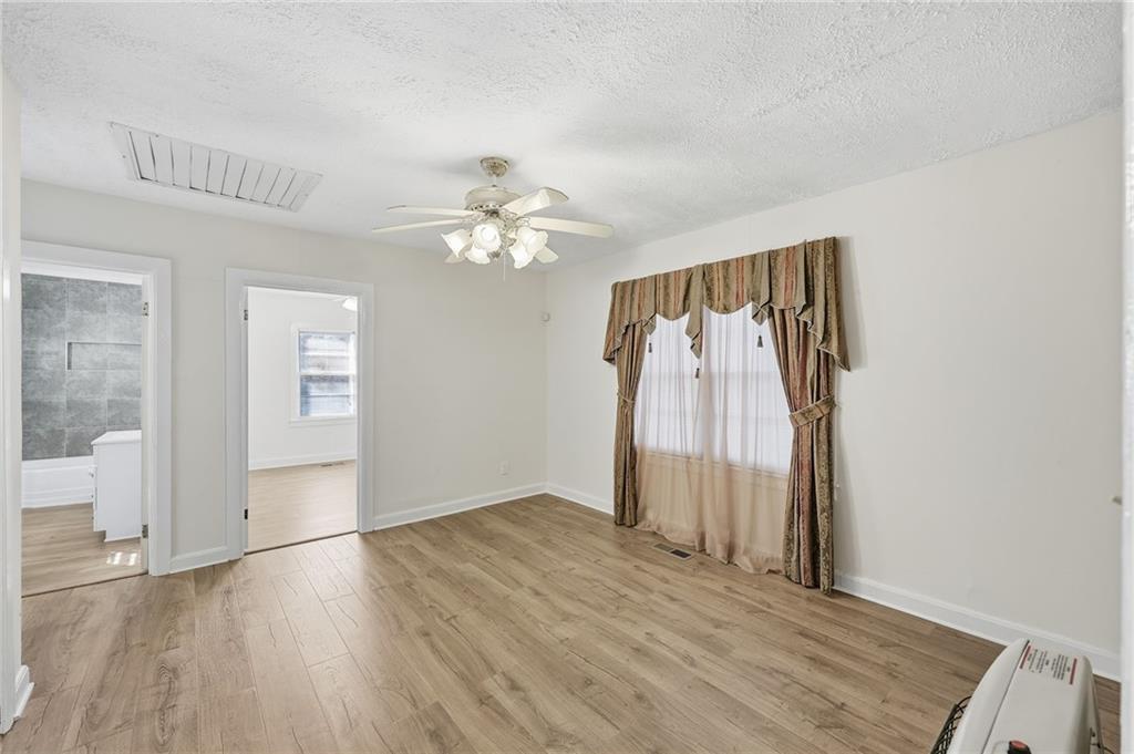 1304 Pine Valley Road Gainesville, GA 30501 - Photo 14 of 30 wooden floor in an empty room with a window