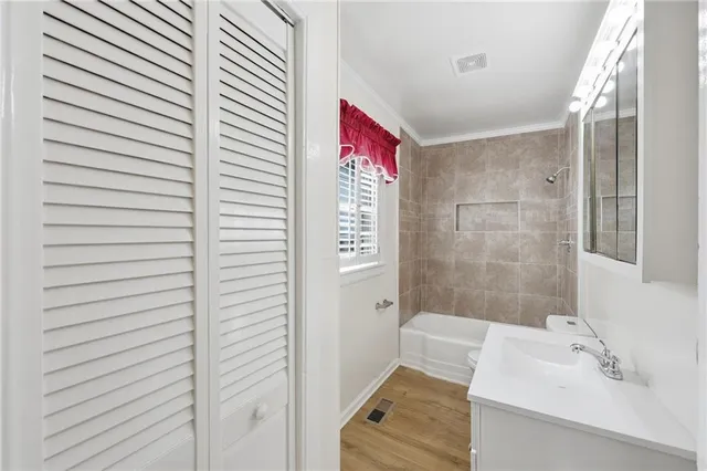 a bathroom with a bathtub and shower