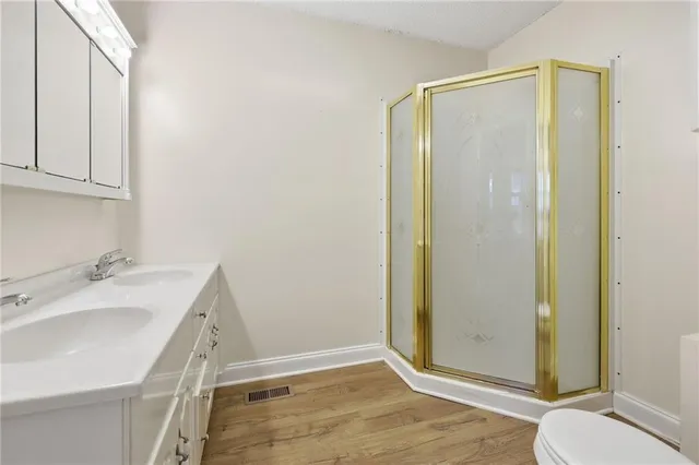 a bathroom with a sink and toilet