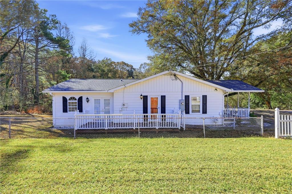 1304 Pine Valley Road Gainesville, GA 30501 - Photo 25 of 30 a view of a house with a backyard and a patio