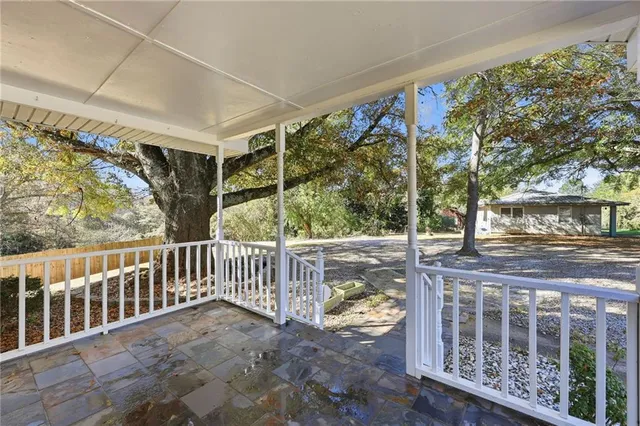 a view of balcony with wooden floor