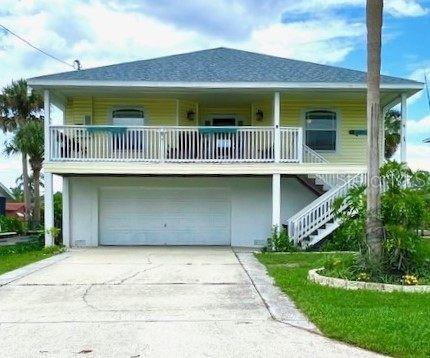 5439 Bluepoint Drive Port Richey, FL 34668 - Photo 1 of 1 a front view of a house with a garden