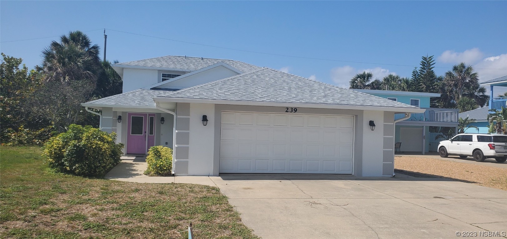 239 Kirkland Road New Smyrna Beach, FL 32169 - Photo 1 of 36 a view of a house with potted plants and a car parked