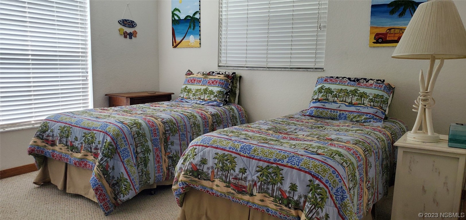 239 Kirkland Road New Smyrna Beach, FL 32169 - Photo 11 of 36 a bedroom with two beds and a lamp on table