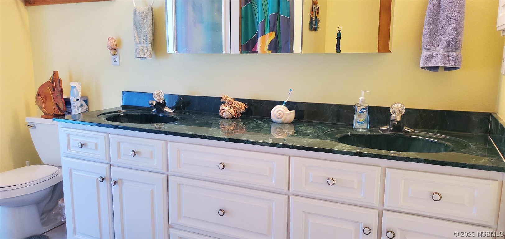 239 Kirkland Road New Smyrna Beach, FL 32169 - Photo 13 of 36 a kitchen with granite countertop white cabinets and sink