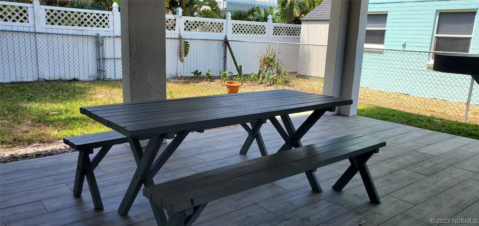 239 Kirkland Road New Smyrna Beach, FL 32169 - Photo 14 of 36 a view of a table and chairs on the deck