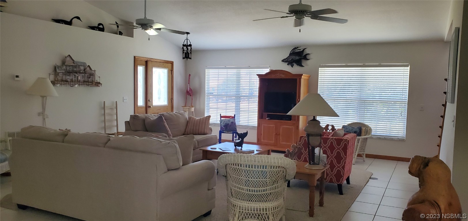 239 Kirkland Road New Smyrna Beach, FL 32169 - Photo 20 of 36 a living room with furniture a couch and a window