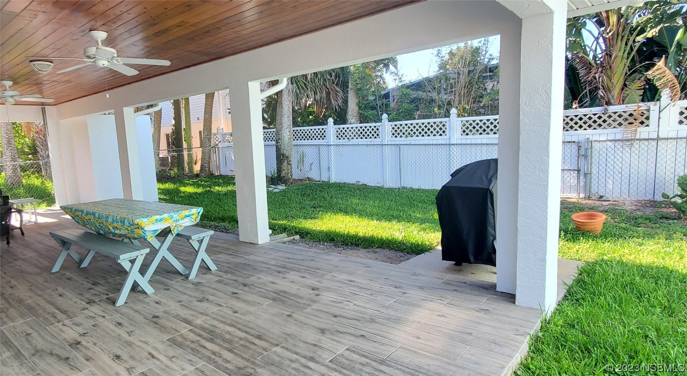 239 Kirkland Road New Smyrna Beach, FL 32169 - Photo 23 of 36 a view of backyard with a garden and outdoor seating
