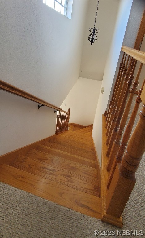 239 Kirkland Road New Smyrna Beach, FL 32169 - Photo 28 of 36 a bedroom with a bed and wooden floor