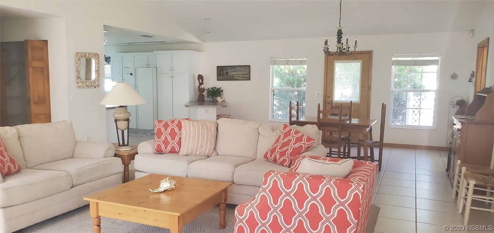 239 Kirkland Road New Smyrna Beach, FL 32169 - Photo 30 of 36 a living room with furniture and a chandelier