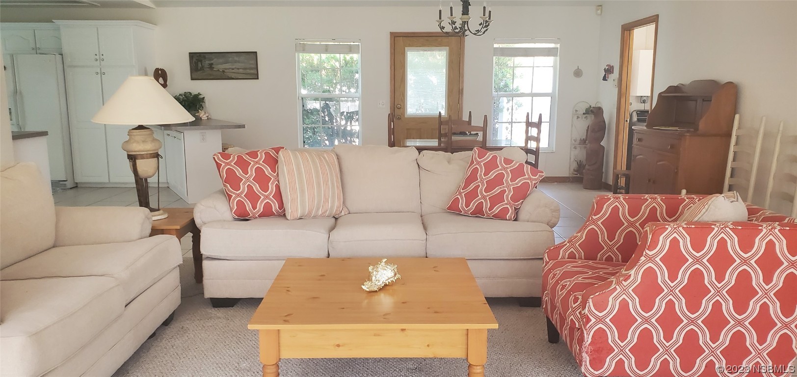 239 Kirkland Road New Smyrna Beach, FL 32169 - Photo 35 of 36 a living room with furniture and a lamp