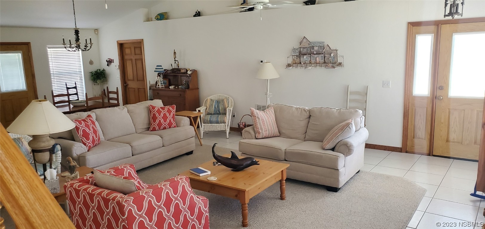 239 Kirkland Road New Smyrna Beach, FL 32169 - Photo 9 of 36 a living room with furniture and a chandelier
