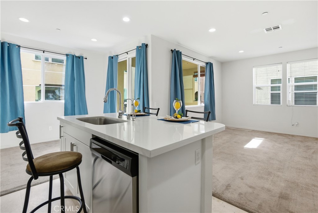 11123 Legion Loop, Unit 101 El Monte, CA 91731 - Photo 4 of 30 Island Kitchen Dining areaand Living Room