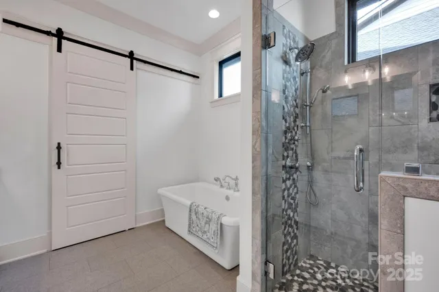 a bathroom with a shower and a sink