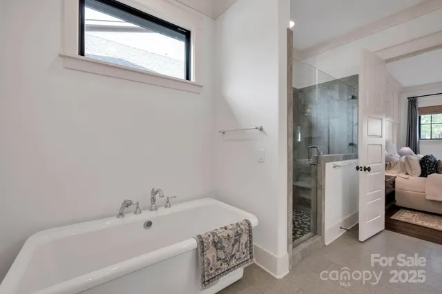 a bathroom with a bathtub and a sink