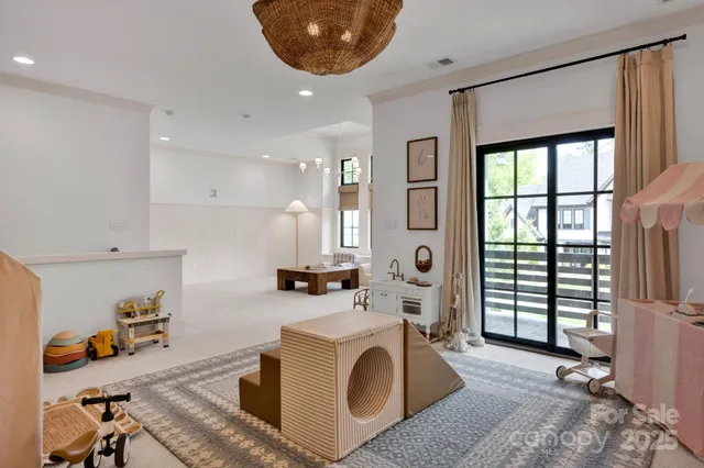 a bed sitting in a bedroom next to a chandelier