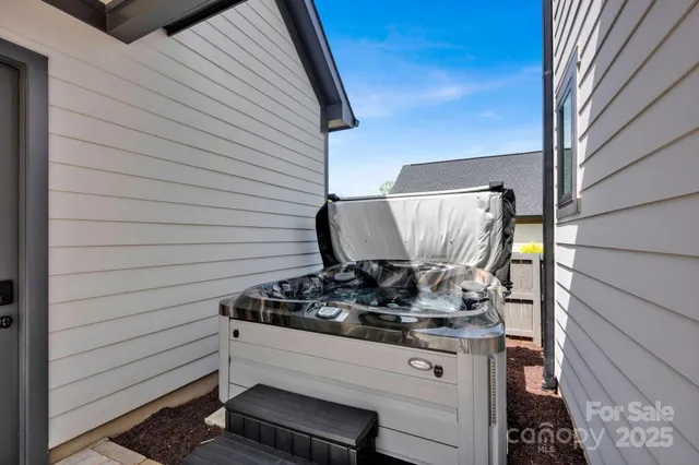 a view of a dining room with furniture wooden floor and chandelier