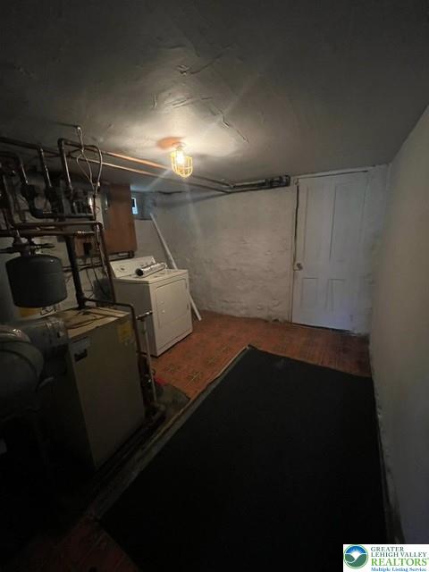 135 West Ridge Street Nesquehoning, PA 18240 - Photo 3 of 6 A functional unfinished lower level provides storage space alongside laundry and utility hookups.