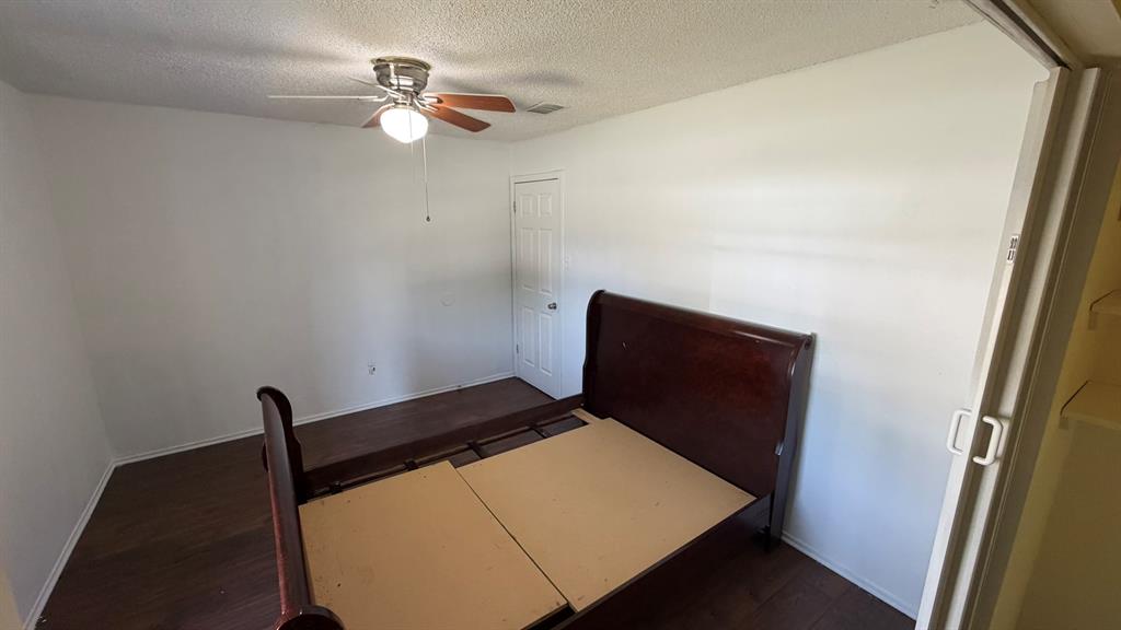 812 Reveille Road Fort Worth, TX 76108 - Photo 9 of 22 Wood-finish flooring with white walls and a ceiling fan with integrated lighting