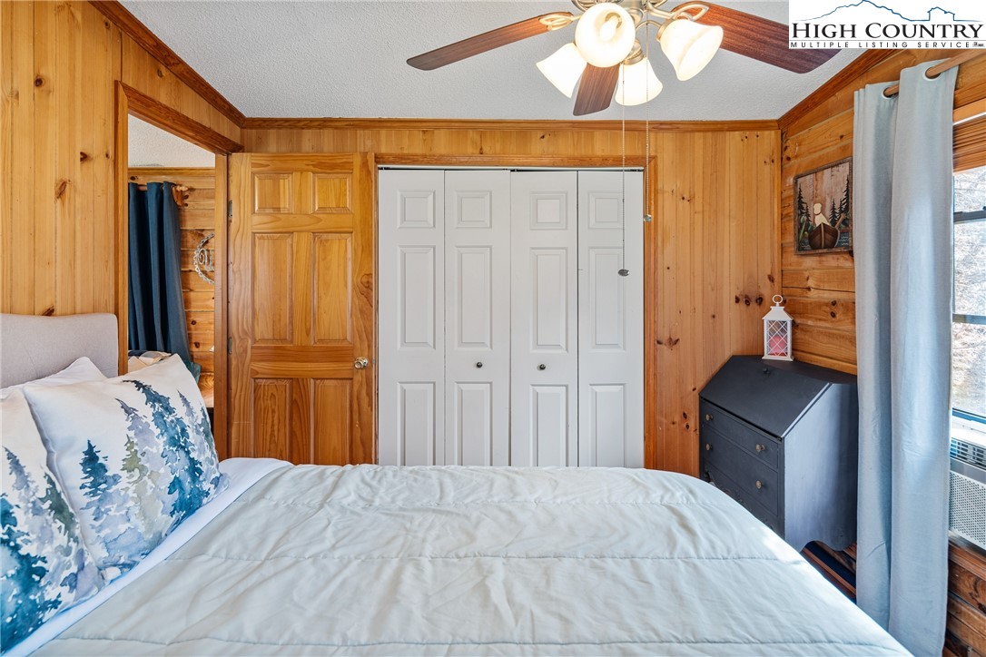 2408 Todd Railroad Grade Road Todd, NC 28684 - Photo 12 of 46 a bedroom with a bed and a mirror