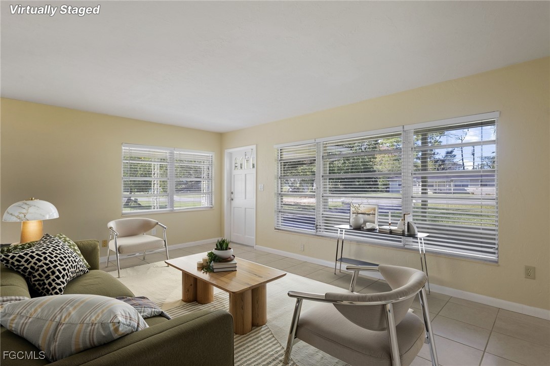 112 Clayton Avenue Lehigh Acres, FL 33936 - Photo 3 of 21 a living room with furniture and a window