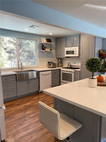 a bedroom with a bed and a mirror