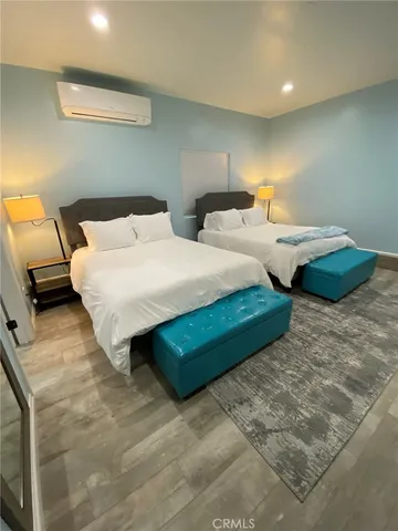 a white toilet sitting next to a small sink