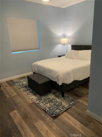 a bathroom with a double vanity sink toilet and shower