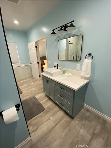a bathroom with a bathtub and shower