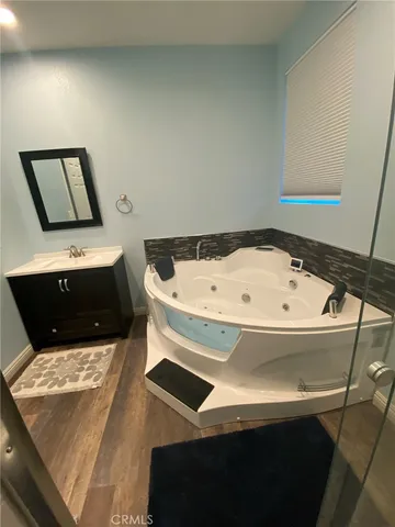 a view of a hallway with wooden shelves
