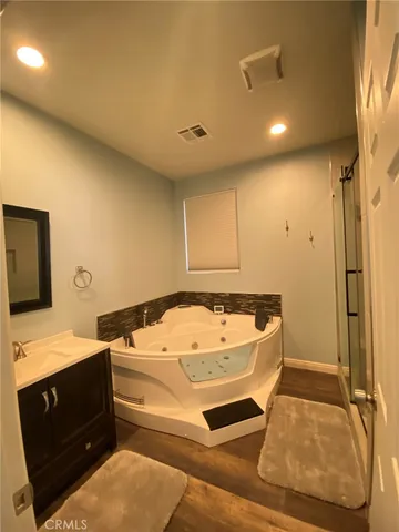 a view of a large building in middle of the green field