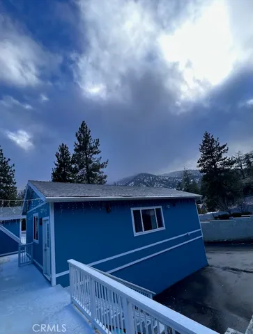 a kitchen with stainless steel appliances granite countertop a sink dishwasher and a stove with wooden floor