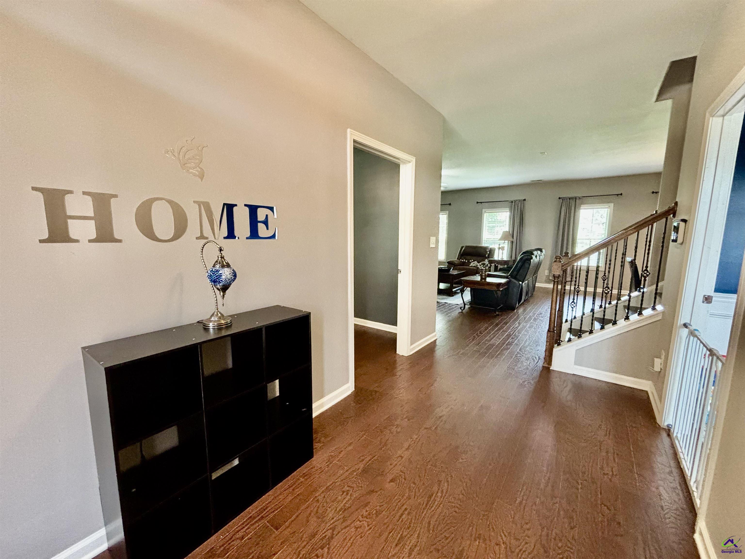 600 Post Oak Way Warner Robins, GA 31088 - Photo 8 of 50 a living room with furniture and a wooden floor