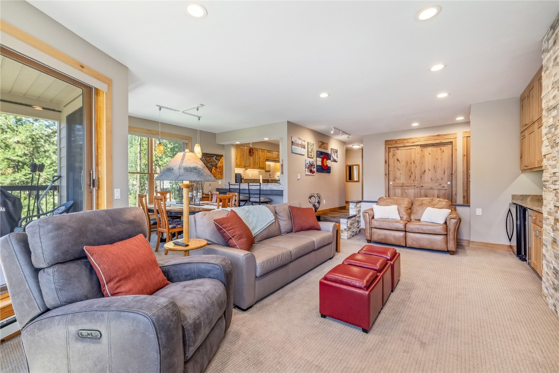 180 Tennis Club Road, Unit 1636 Keystone, CO 80435 - Photo 6 of 34 Carpeted living room featuring rail lighting